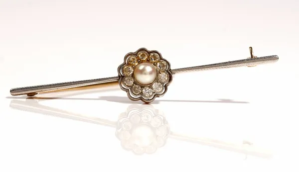 A gold, diamond and cultured pearl set cluster bar brooch, mounted with the cultured pearl to the centre, in a surround of ten circular cut diamonds,