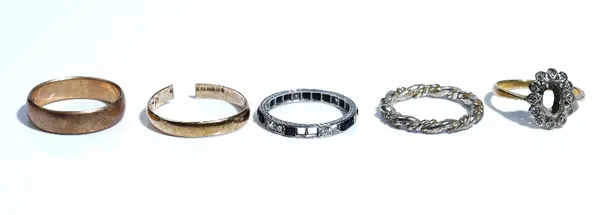 A gold and diamond set oval ring mount, (the central gemstone lacking), apparently unmarked, a black onyx and diamond eternity ring, (four black onyx