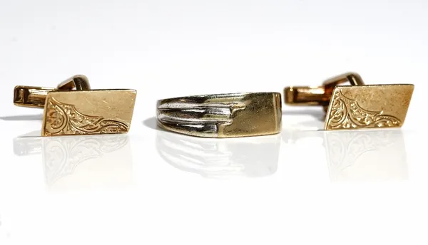 A pair of 9ct gold cufflinks with rectangular fronts and with folding bar fittings at the backs and a 9ct gold signet style ring, ring size T 1/2, com