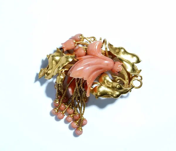 A Victorian gold and coral broach designed as a floral and foliate spray with pendant tassels terminating as coral beads, circa 1870, gross weight 38.