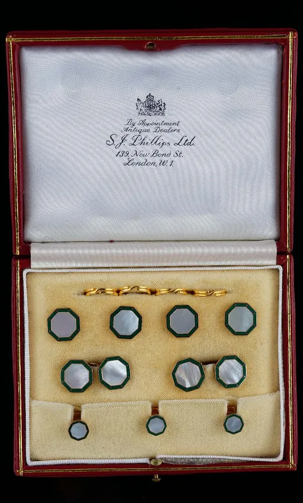 A 9ct gold, mother-of-pearl and green enamelled gentleman's dress set, comprising; a pair of cufflinks, three studs and four buttons, each piece havin