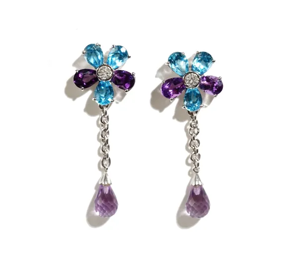 A pair of 9ct white gold, diamond, amethyst and blue topaz earrings, each designed as a flowerhead and with a faceted amethyst briolette drop, the bac