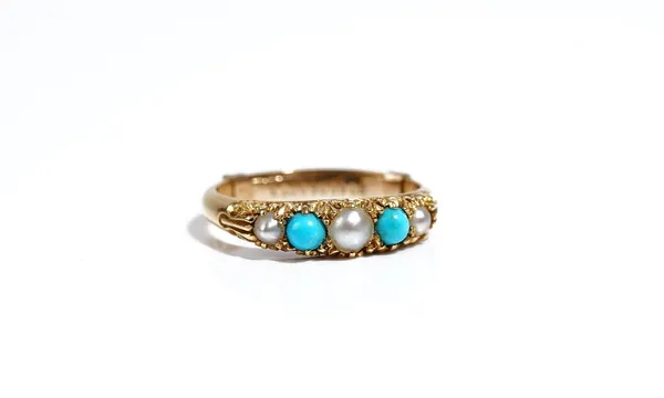 A gold ring, mounted with a row of three half pearls, alternating with two turquoise, the mount decorated with scrolled sides, detailed 18 CT, fitted