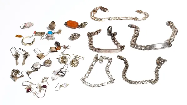 A group of mostly silver mounted jewellery, comprising; ten pairs of earrings, three bracelets, two identity bracelets and eleven odd earrings, (26).