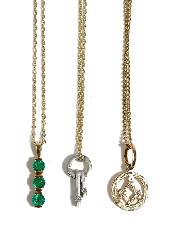 A 9ct gold and emerald three stone pendant, with a gold neckchain, on a boltring clasp, detailed 375, a diamond set two stone pendant, with a gold nec