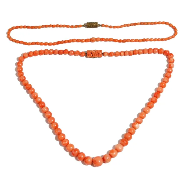 A single row necklace of graduated coral beads, on a silver and carved coral rectangular clasp, decorated with flowers, detailed 935, length 45cm, gro