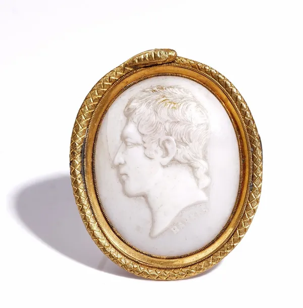 A Victorian oval shell cameo brooch, carved as the portrait of a gentleman, detailed BANKES, the setting designed as a coiled snake.