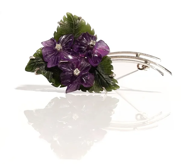 A white gold, carved nephrite, carved amethyst quartz and diamond brooch, designed as a floral spray, each of the three carved amethyst quartz flowerh