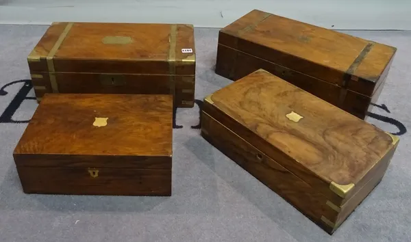 A group of four 19th century mahogany and brass bound writing slopes, the largest 50cmwide x 25cm deep (4).