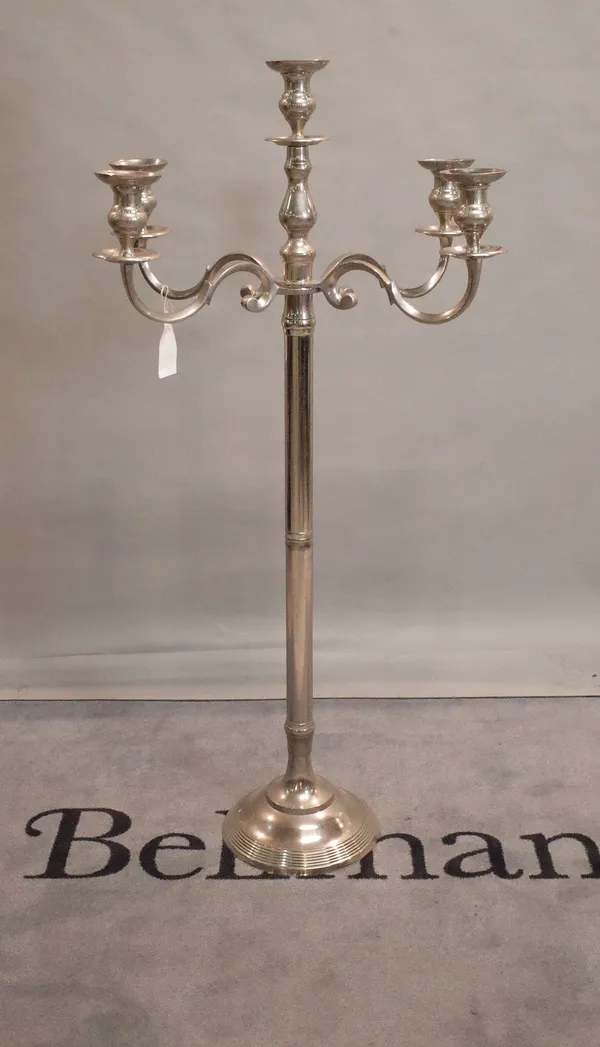 A modern chrome plated floor standing five branch candelabra, 147cm high.