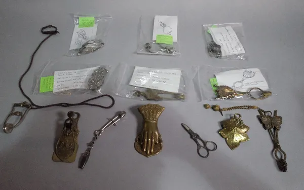 A collection of mostly late Victorian brass skirt lifters (qty).