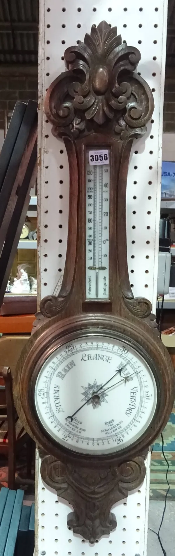 A modern oak cased barometer, 30cm wide x 93cm high.