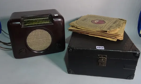 A 20th century cased gramophone, a 20th century Bush radio and a quantity of records.