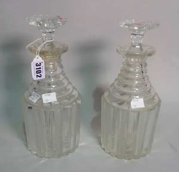 A pair of late Regency cut glass decanters, with stepped necks, 28cm tall.