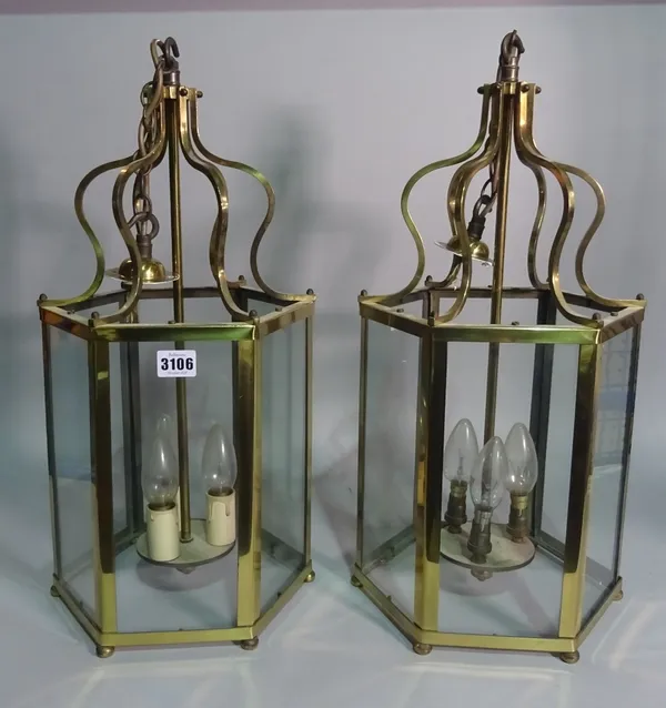 A pair of early 20th century brass octagonal hanging lanterns, 53cm high (2).