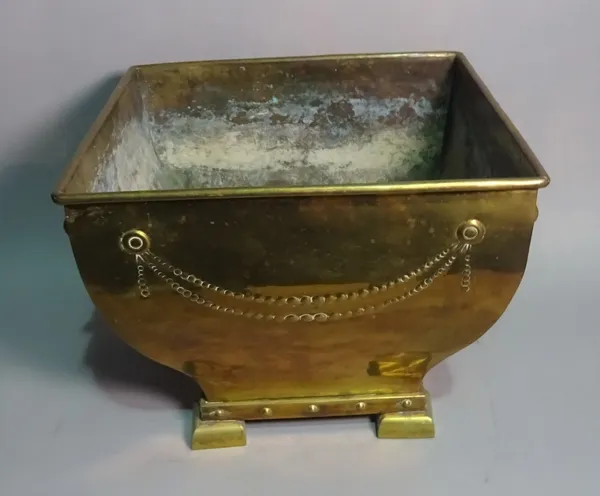 An Edwardian copper coal bucket of tapering square form on bracket feet, 42cm wide x 31cm high.