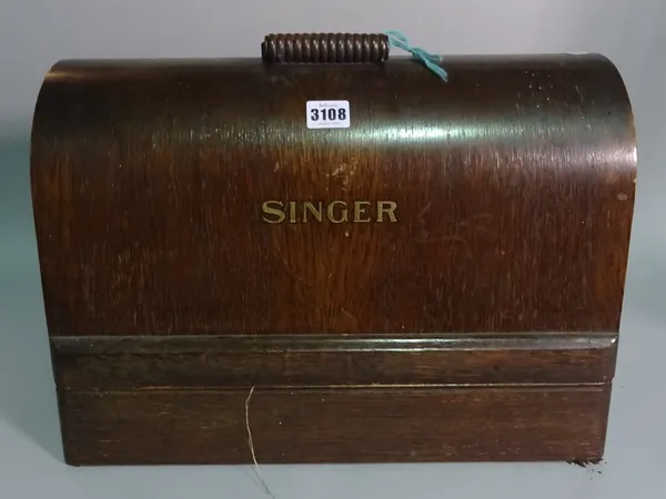 'Singer', an early 20th century cased sewing machine, 44cm wide x 31cm high.