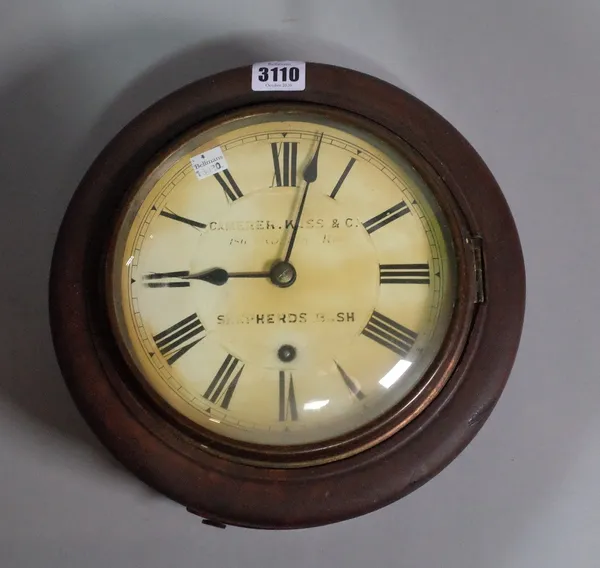 An early 20th century German circular wall clock, one key and one pendulum, 27cm diameter.