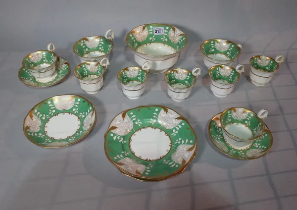 A 19th century porcelain part tea service green decoration and gilt border.