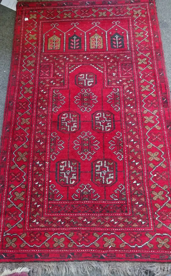 An Afghan prayer rug, 126cm x 74cm.