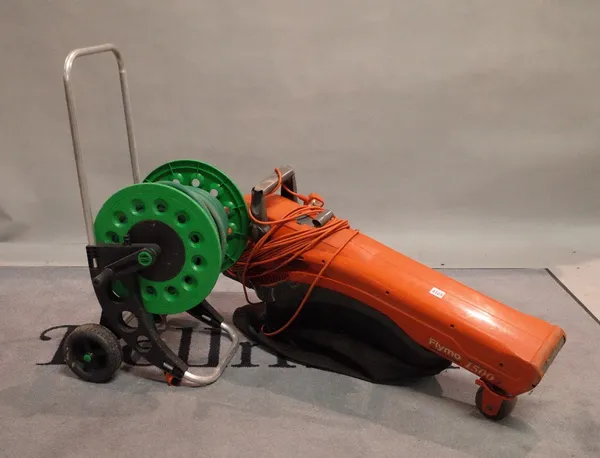 A small electric hedge cutter and a Flymo leaf blower.