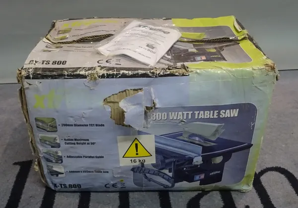 A Challenge Xtreme 800 watt table saw (boxed).