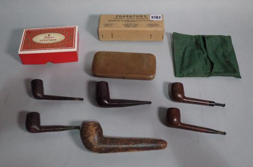 A quantity of early 20th century wooden smoking pipes including a silver mounted Bakelite example (qty).