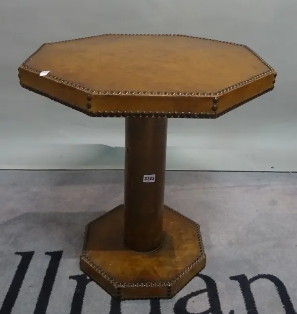 A mid 20th century stained beech and leather upholstered octagonal low centre table, 55cm wide x 61cm high.