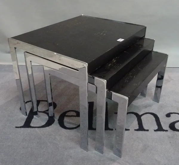 A modern chrome and black painted ash nest of three tables, the largest 58cm wide x 46cm high.