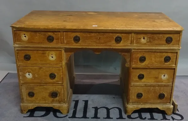 A Victorian pine kneehole desk with drawers about the knee on plinth base, 122cm wide x 72cm high.