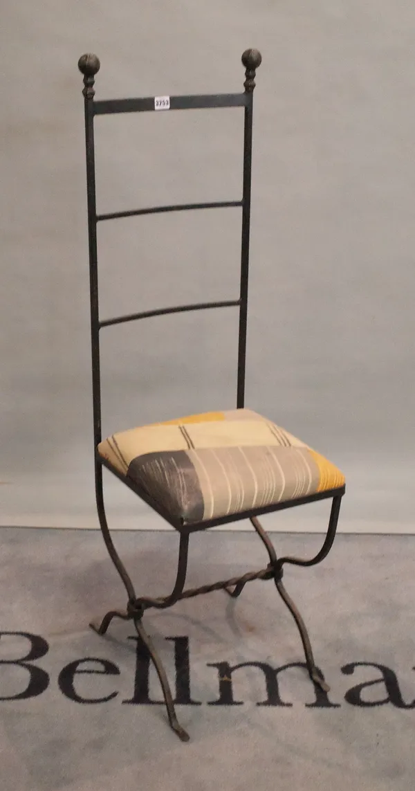 After Charles Mackintosh, a modern wrought iron highback chair, 36cm wide x 123cm high.