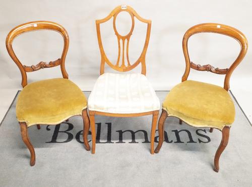 A set of three 19th century satinwood shieldback dining chairs 44cm wide x 94cm high and a pair of Victorian mahogany balloon back dining chairs, 41cm
