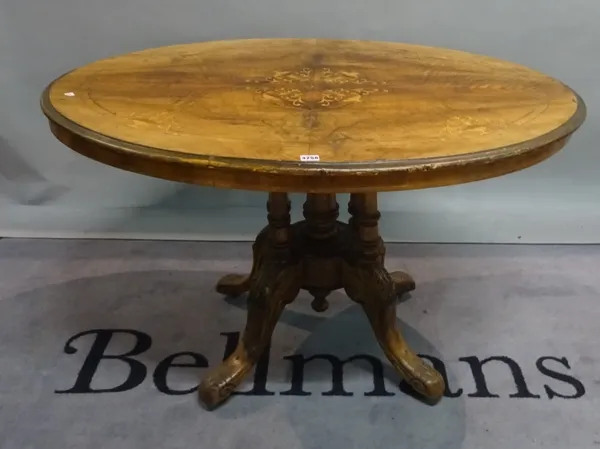 A Victorian style inlaid walnut oval centre table, 115cm wide x 65cm high.