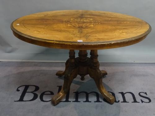 A Victorian style inlaid walnut oval centre table, 115cm wide x 65cm high.