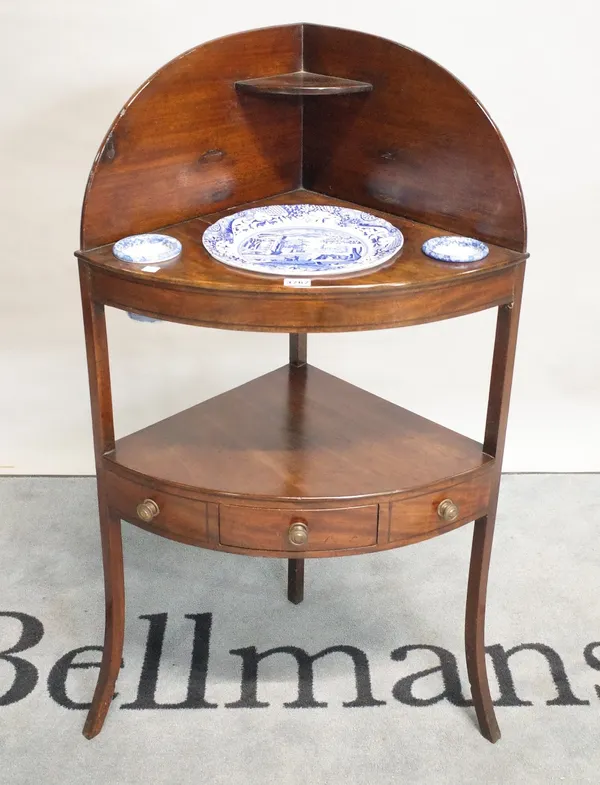 A George III mahogany corner washstand with single drawer undertier, 59cm wide x 106cm high.