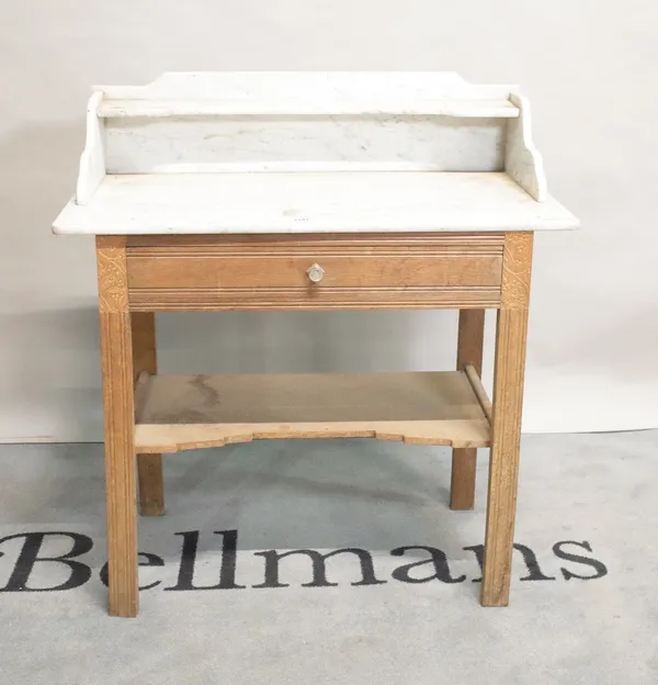 An early 20th century pine side table with a white galleried top, 90cm wide x 98cm high.