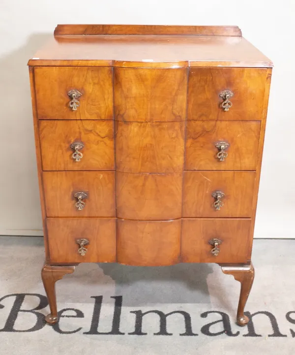 A modern walnut chest of four long drawers on cabriole supports, 75cm wide x 108cm high.