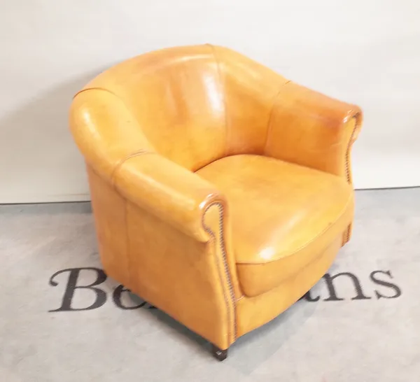 'Joris'; a tan leather tub chair with maker's stamp, 82cm wide x 74cm high.