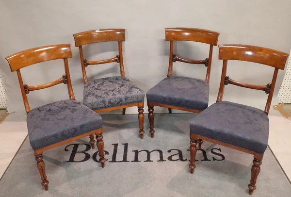 A set of four Victorian walnut bar back dining chairs on turned supports, 46cm wide x 85cm high.