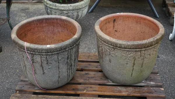 A pair of modern reconstituted stone planters with floral motif decoration, 55cm diameter x 46cm high (2).