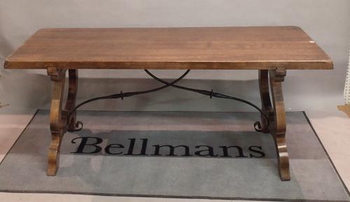 A modern Italian stained beech  refectory table united by a wrought iron stretcher 180cm wide x 74cm high.