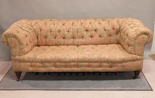 A late Victorian mahogany framed Chesterfield sofa with button back upholstery on ring turned supports, 200cm wide x 70cm high.