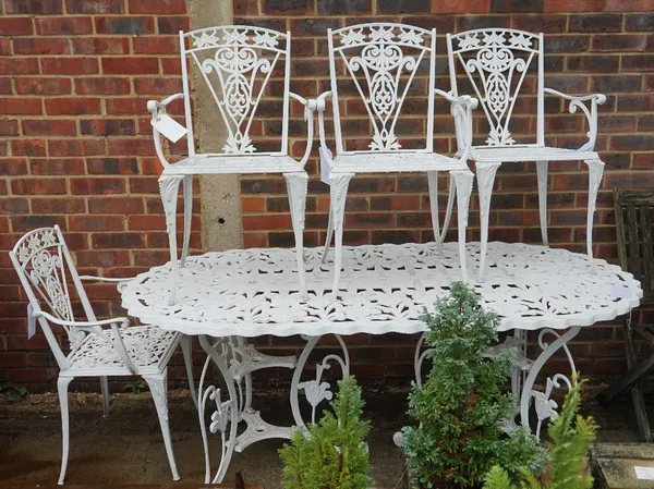 A modern white painted metal oval garden table,180cm wide x 71cm high and an associated set of six modern white painted metal open armchairs, 46cm wid