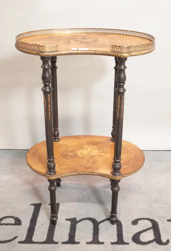 A 19th century continental kidney shaped two tier occasional table on gilt metal mounted ebonised supports, 51cm wide x 78cm high