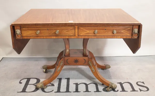 A late 19th century mahogany and ebony inlaid sofa table on four outswept supports, 95cm wide x 69cm high