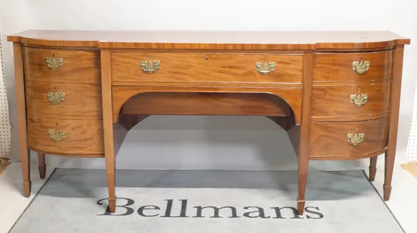 A George III style mahogany bowfront sideboard. Single freize drawer flanked by cupboard doors, 222cm wide x 96cm high