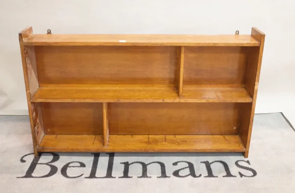 An early 20th century oak two tier hanging shelf, 130cm wide x 56cm high.