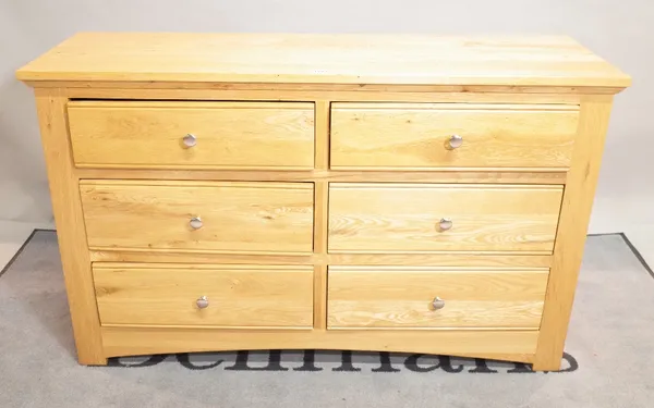 A modern oak side chest of six short drawers, 126cm wide x 78cm high.