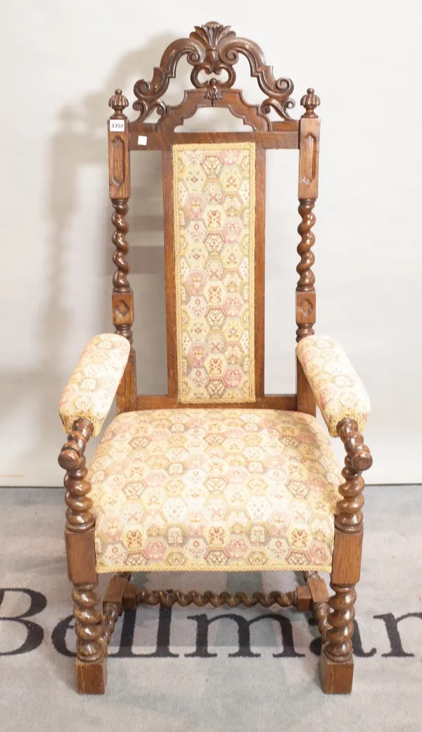 An 18th century style oak open armchair on barley twist supports, 60cm wide x 129cm high