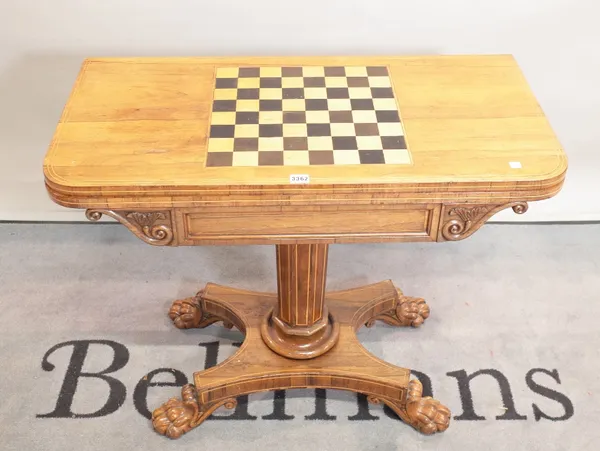 A Victorian inlaid rosewood card table on turned, octagonal column on four claw supports, 92cm wide x 74cm high